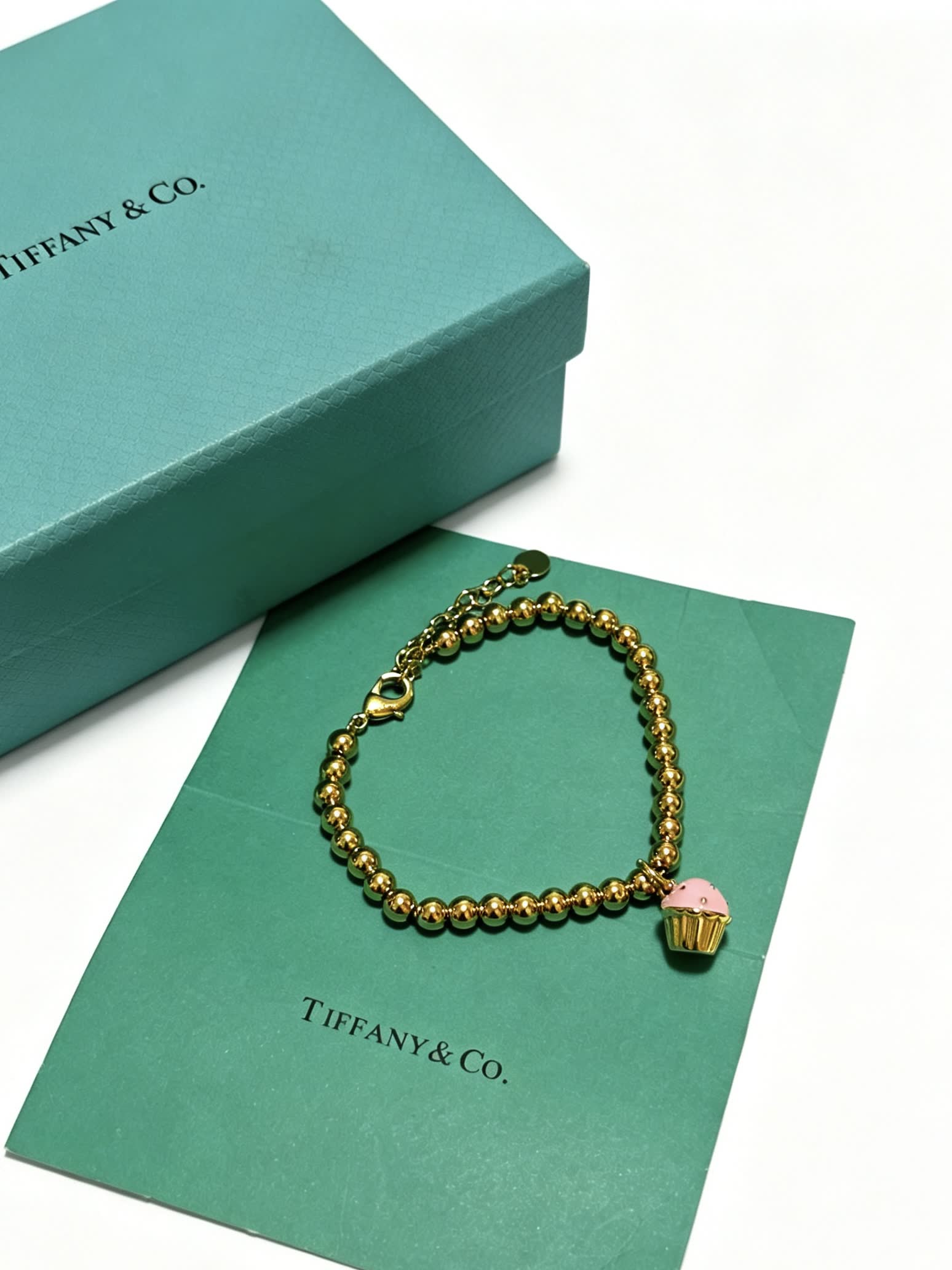 Tiffany & Co. Gold Bead Bracelet with Cupcake Charm Tiffany & Co. Gold Bead Bracelet with Cupcake Charm